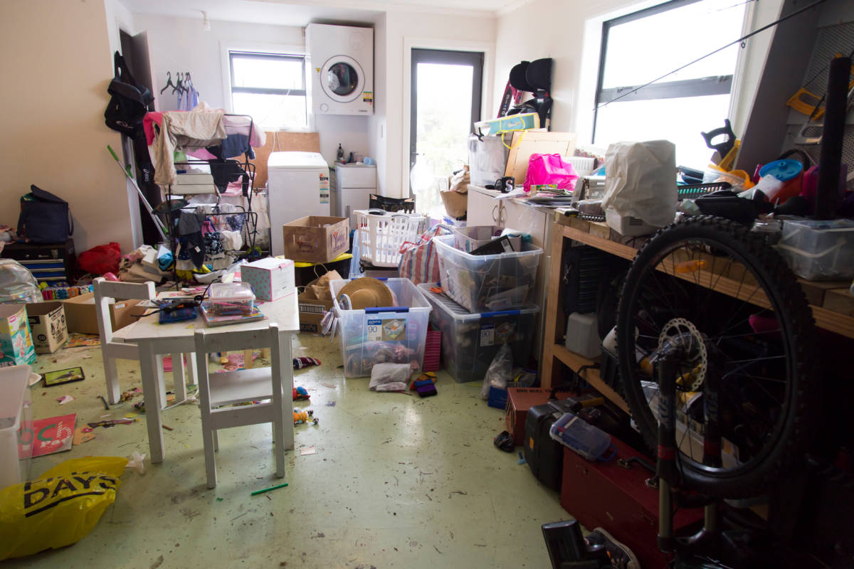 room full of junk inside of home that needs to have junk removal services